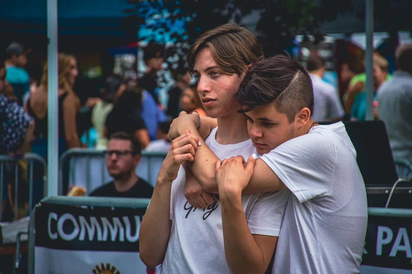 Two teens embracing in a moment of comfort
