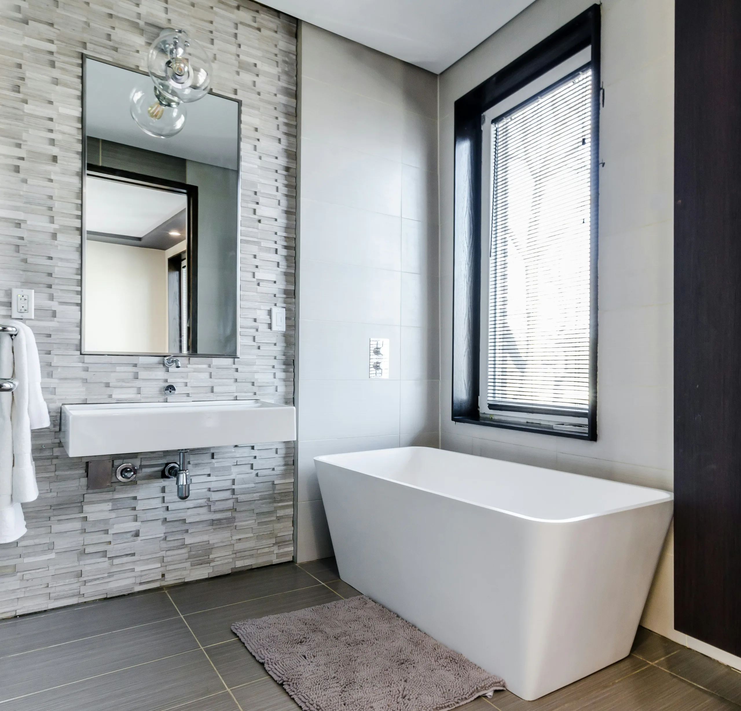 Renovated bathroom in Rathmines, Dublin, with freestanding bathtub near a window