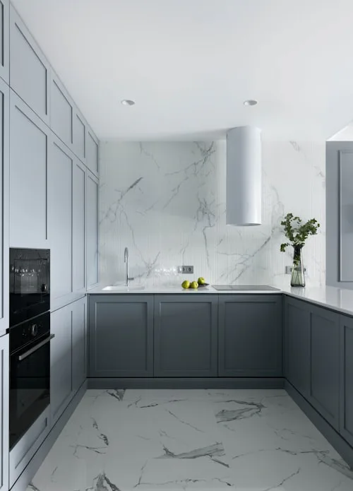 Modern kitchen with marble floor tiles and grey cabinets, kitchen tiling Dublin