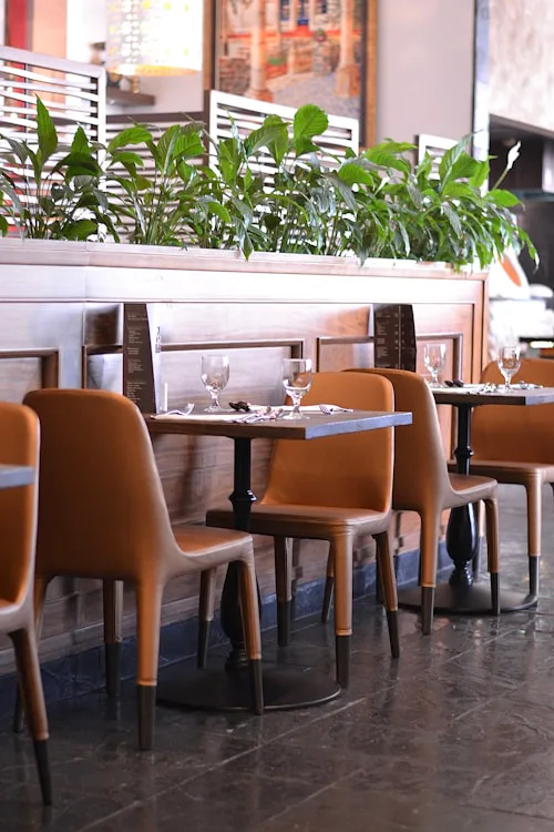Empty restaurant dining room set for service, commercial tiling Dublin