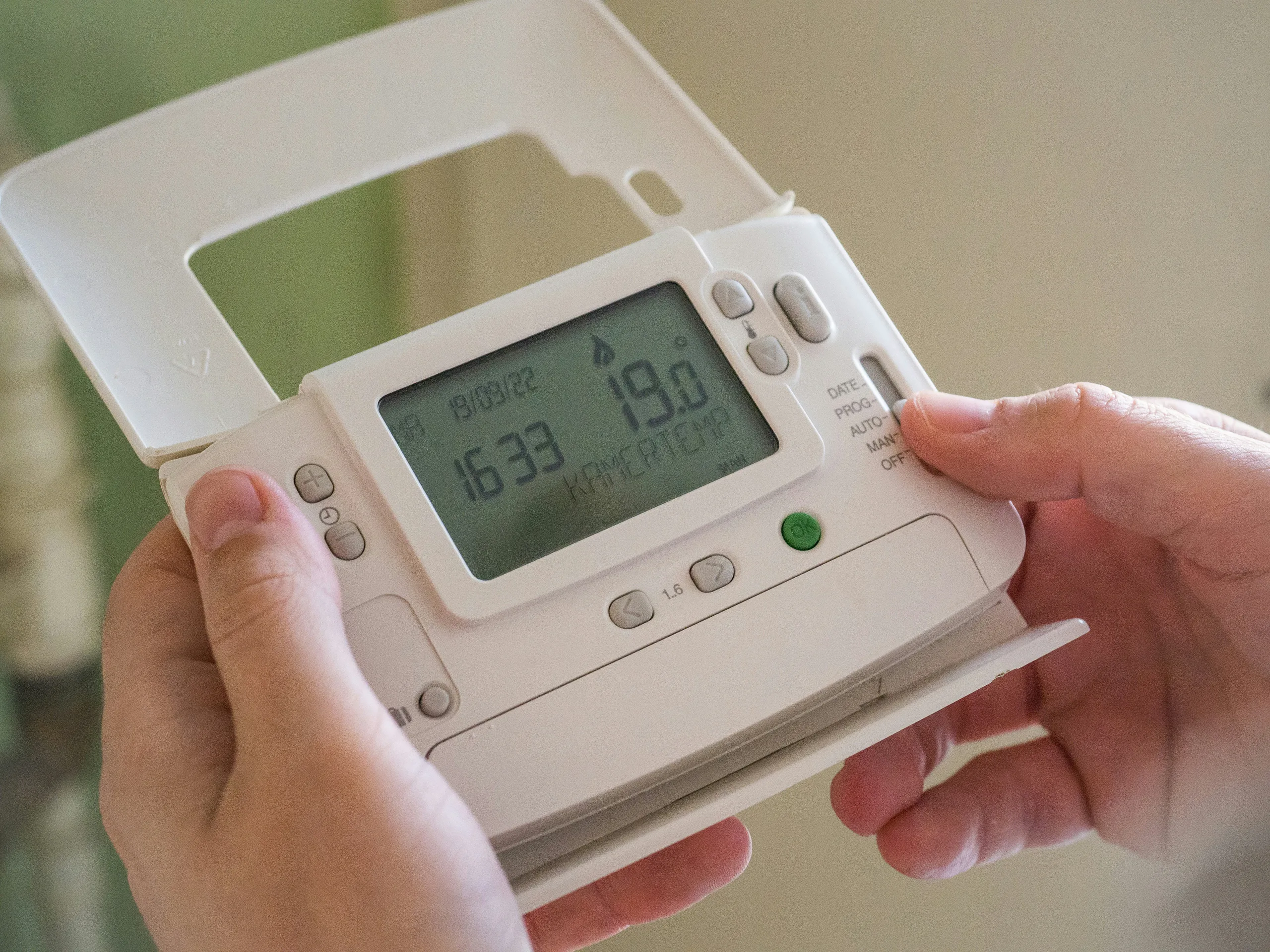 Person checking a home energy meter reading