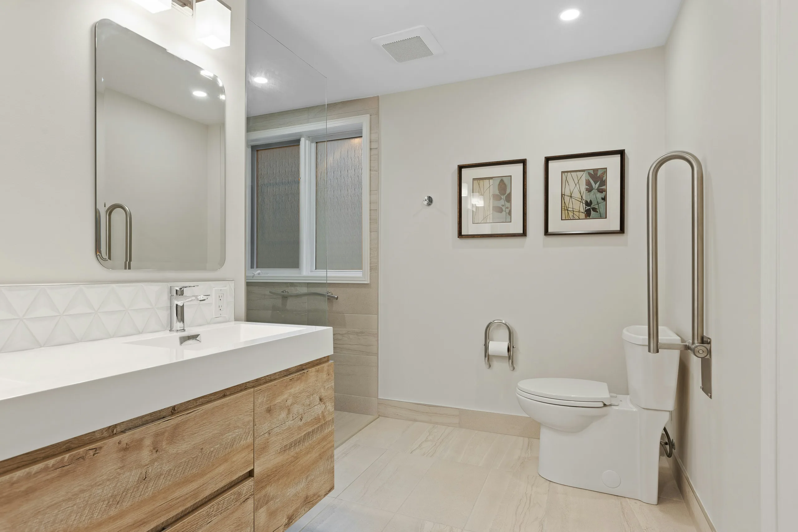 Modern accessible bathroom with walk-in shower and wall-mounted basin