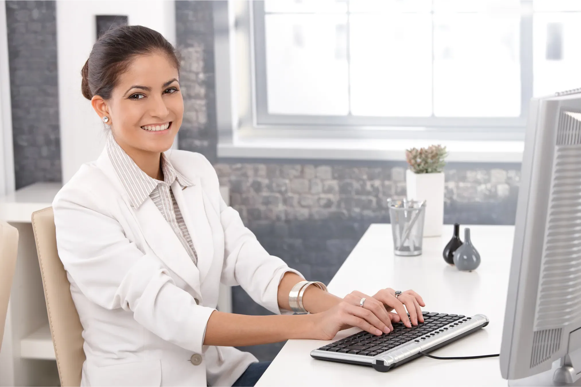 Business professional working confidently at her desk