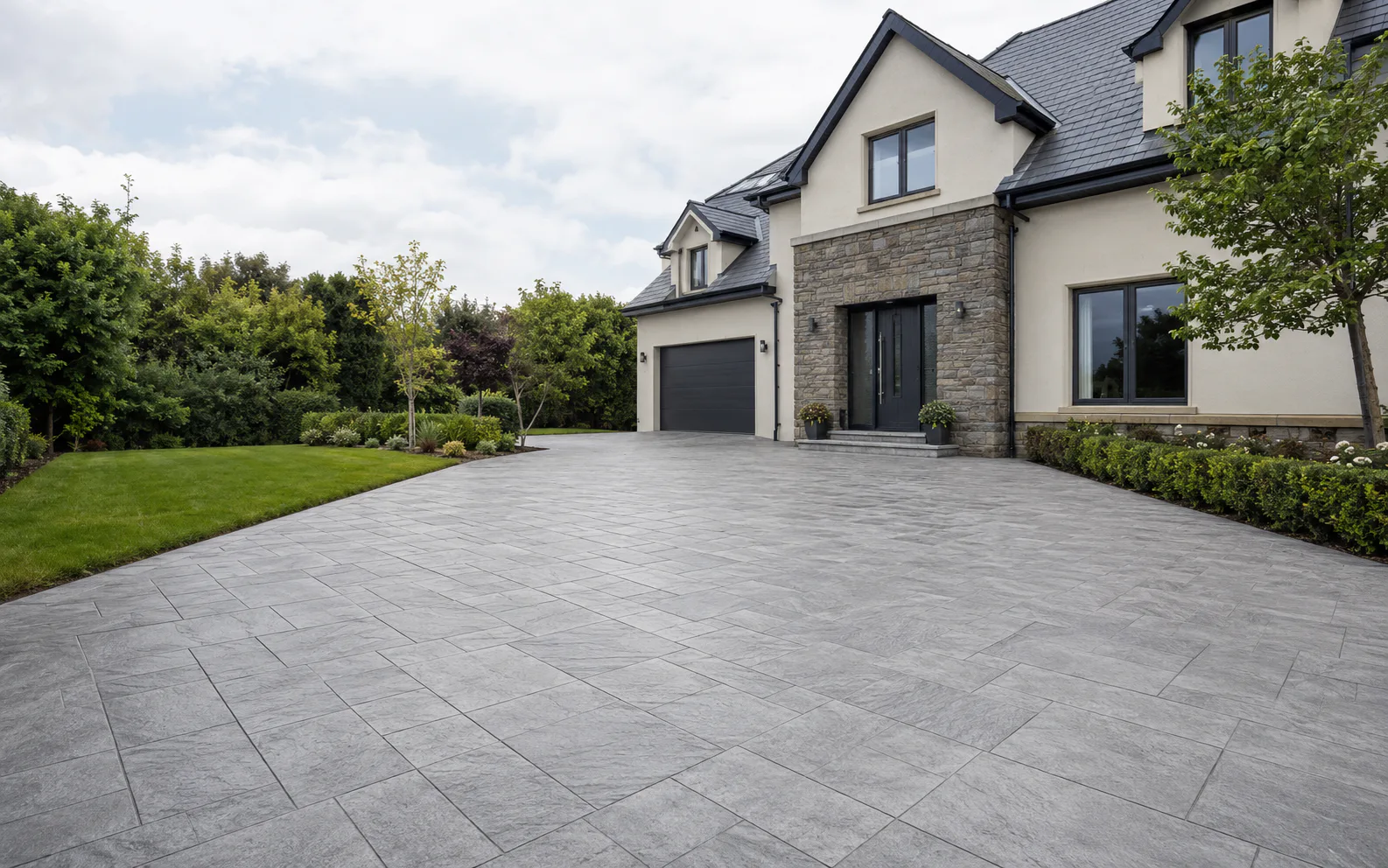 Light grey patterned concrete driveway at a modern Dublin home