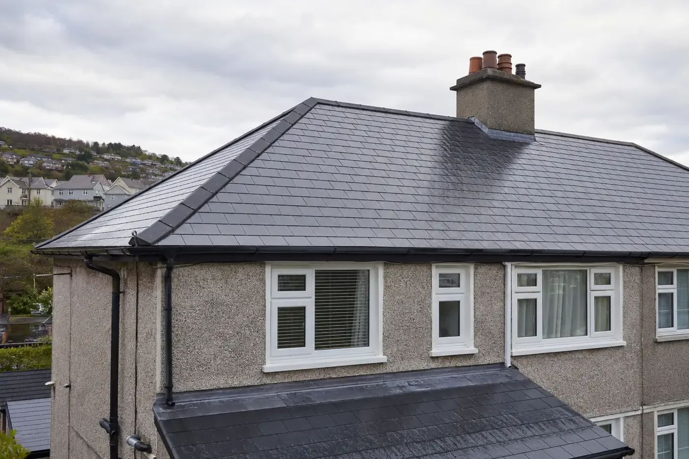 New dark slate roof on a Cork home after rain